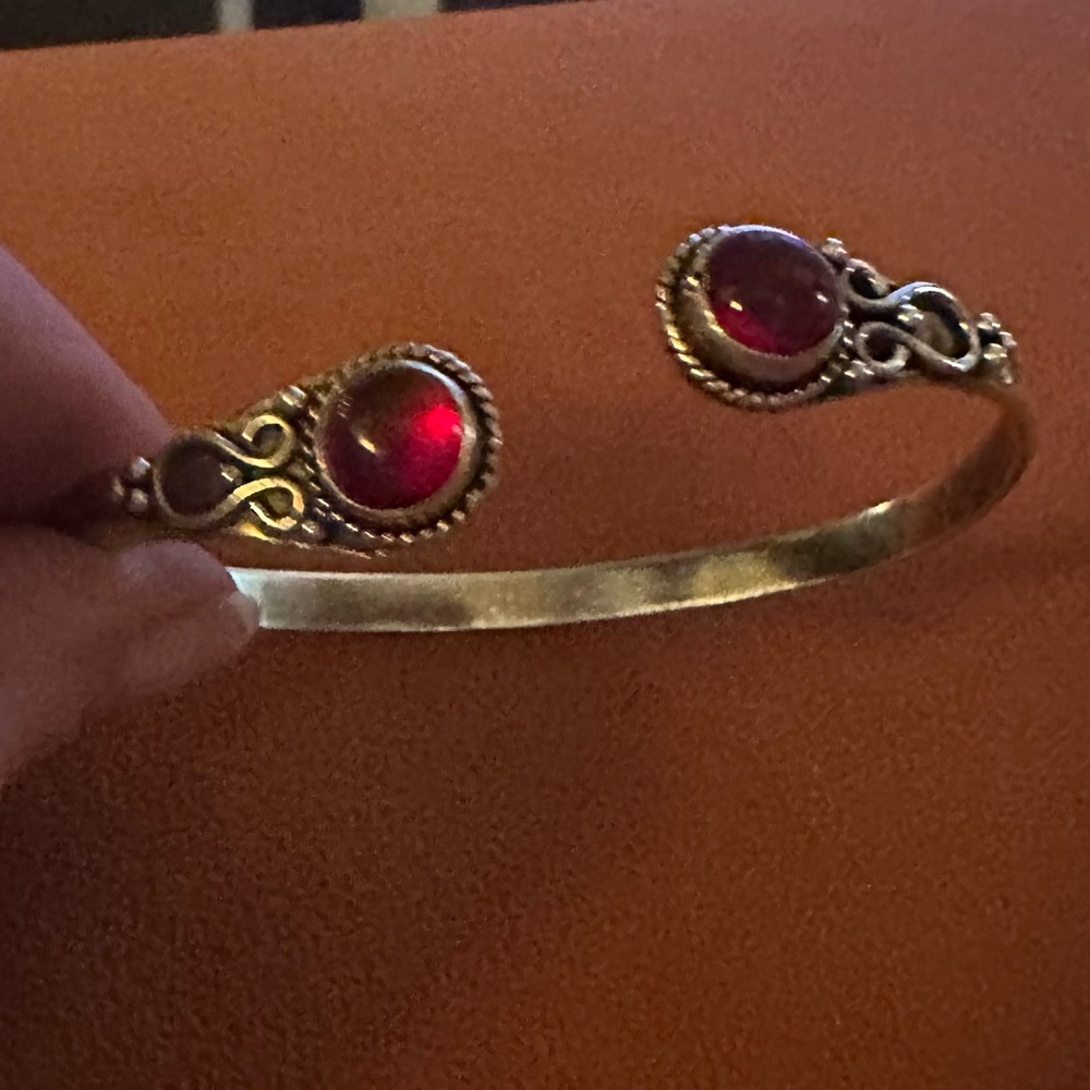 Sterling silver bangle with red stones